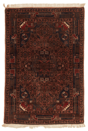 Tapis Nahavand Iran rouge avec médaillon central 157x106cm fait main avec motifs persans traditionnels
