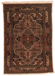 Tapis Nahavand Iran rouge avec médaillon central 150x100cm fait main avec motifs persans traditionnels