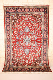 Tapis Pendjab rouge 181 × 127 cm, vue d'ensemble avec médaillon bleu clair et franges ivoire