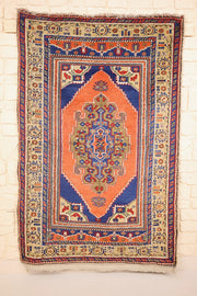 Tapis Tachpinar orange et bleu 180 × 100 cm, vue d'ensemble avec franges aux deux bouts
