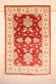 Tapis Ziegler rouge 149 × 99 cm, vue d'ensemble du champ fleuri et de la bordure beige